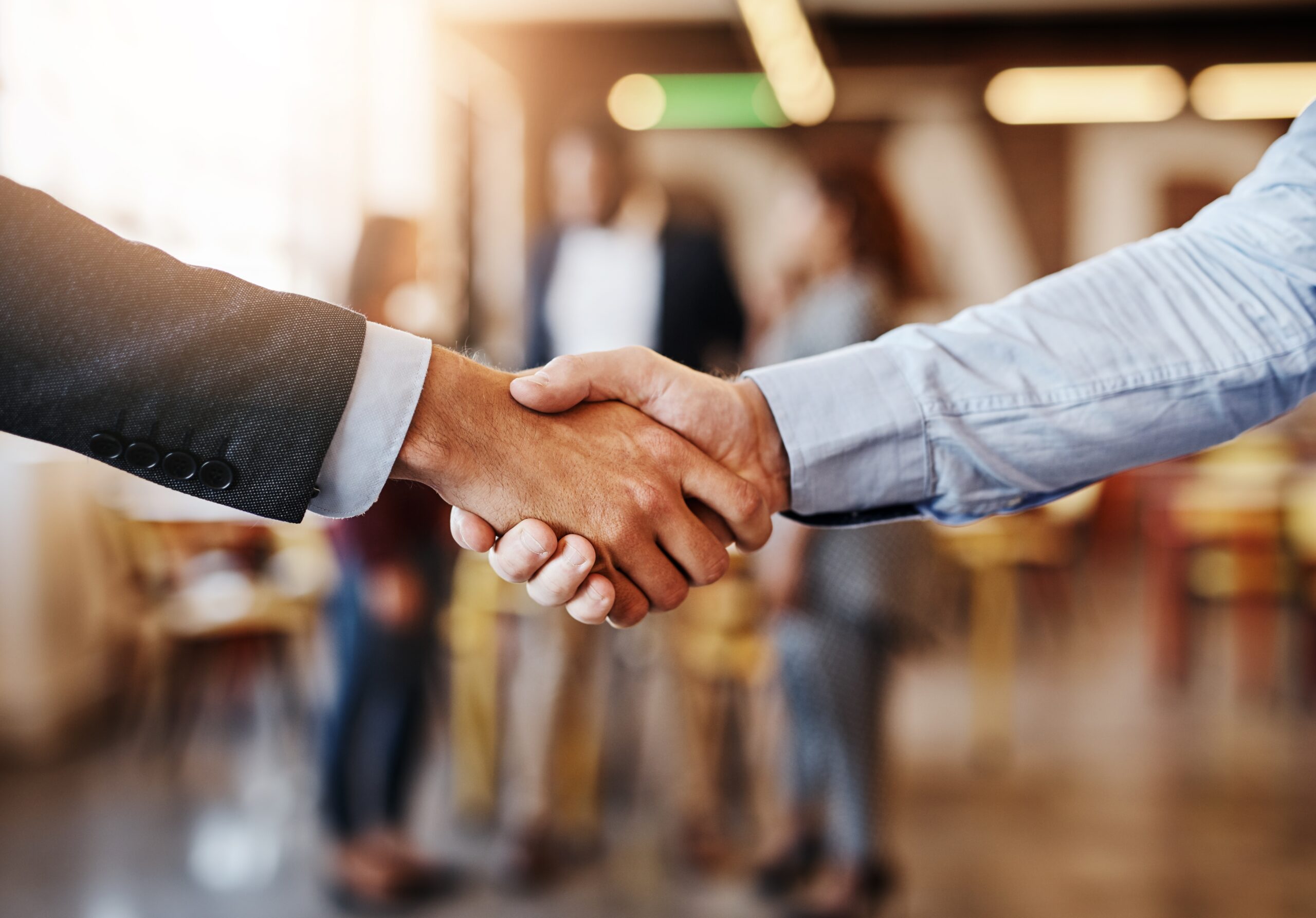 shaking hands after direct sales deals