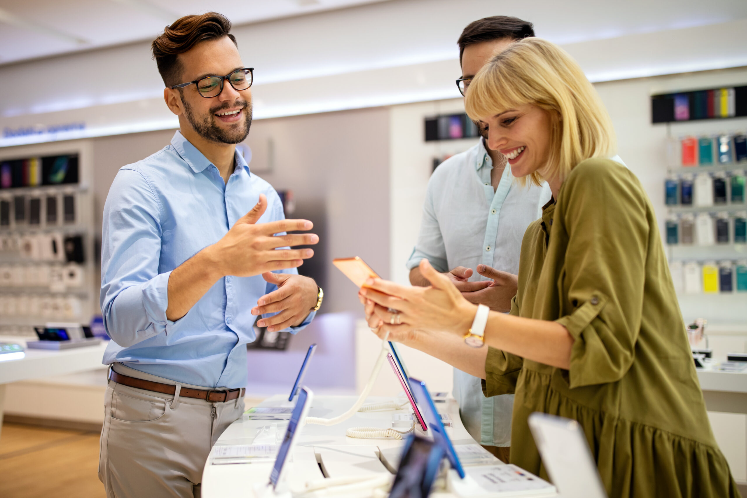 A sales consultant educating prospective customers about the products he’s representing.